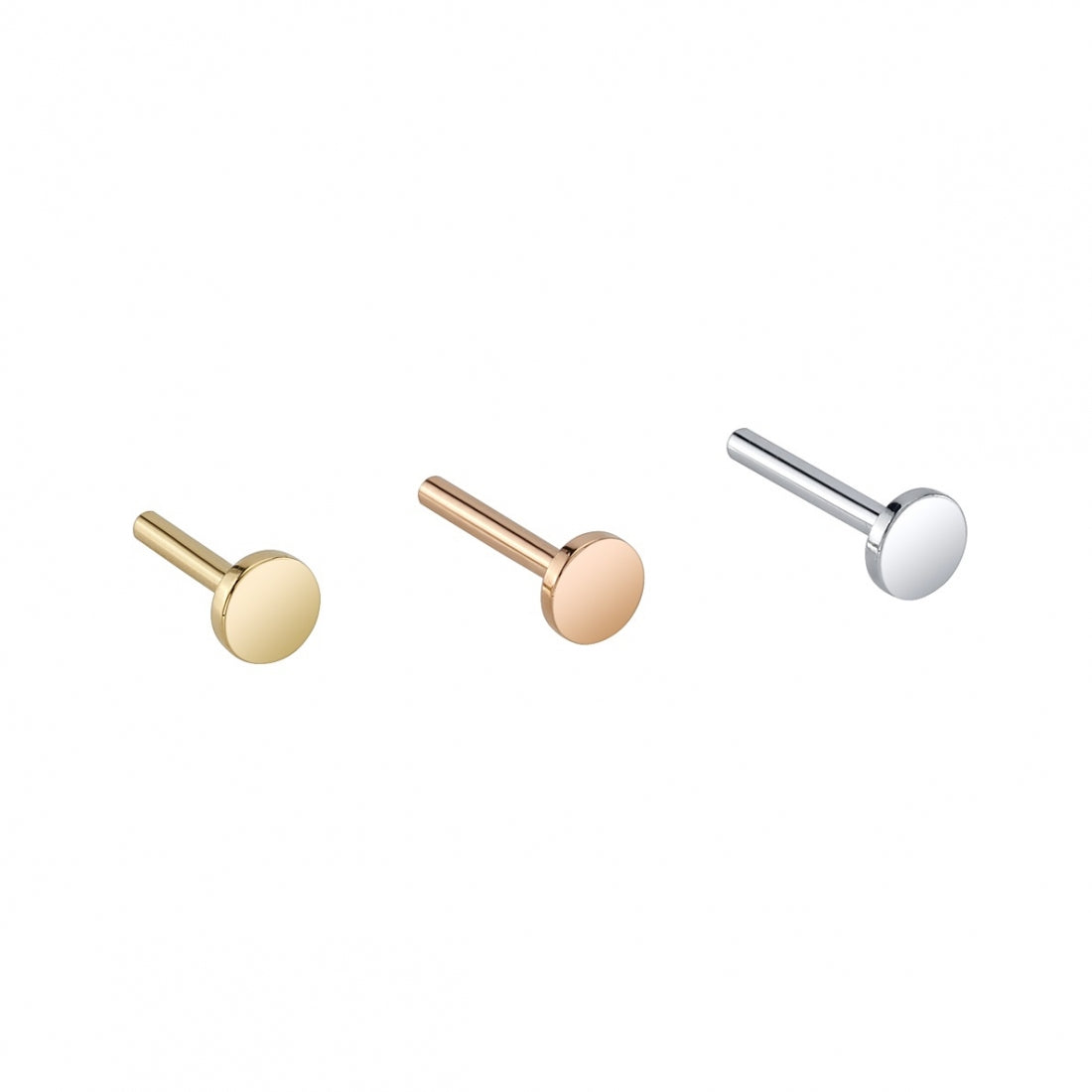 BVLA's "Threadless Labret Post" shown from back angle with the disc facing forward. From left to right in 14k Yellow gold, 14k Rose gold and 14k White gold