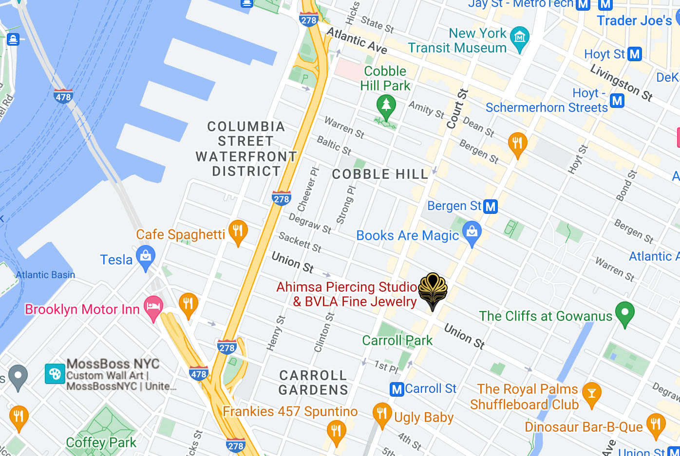 Custom Google Map showing the Carroll Gardens neighborhood in Brooklyn with a pointed Ahimsa Piercing Studio logo in black and gold showing our location