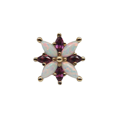 Star-shaped gemstone with opal and pink gemstones on a white background