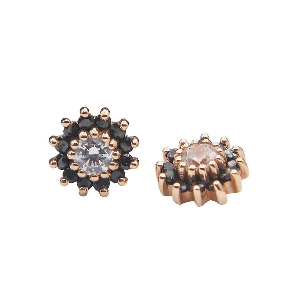 
                  
                    BVLA's "The Rose" in 14k Rose gold with CZ center stone and 12 smaller black CZ circling the center. Shown twice, straight on angle on the left and side angle on the right
                  
                