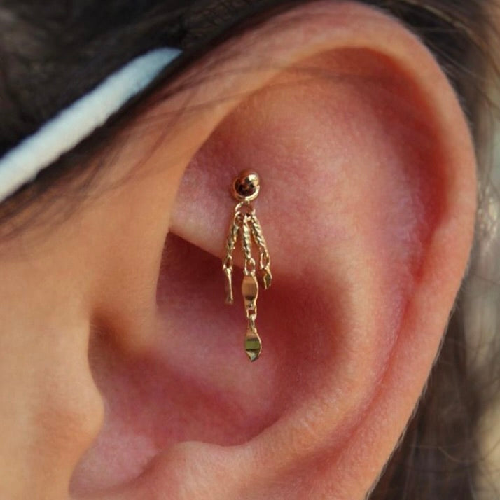 
                  
                    Left ear featuring a healed faux rook piercing with a 14k Yellow gold BVLA "Dome" with a 14k Yellow gold BVLA "Portia Chain" dangling from it
                  
                