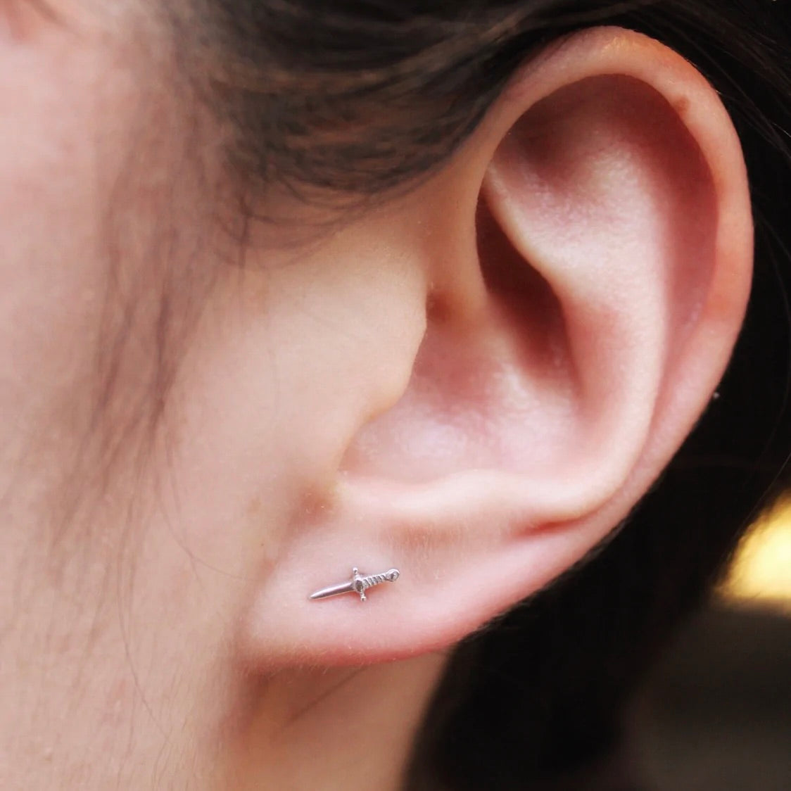 BVLA's "Slasher Dagger" in 14k White gold. Shown on a first lobe left ear piercing